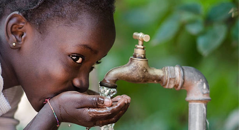 Beautiful Portrait of African Children Drinking Outdoors Fresh Water from tap