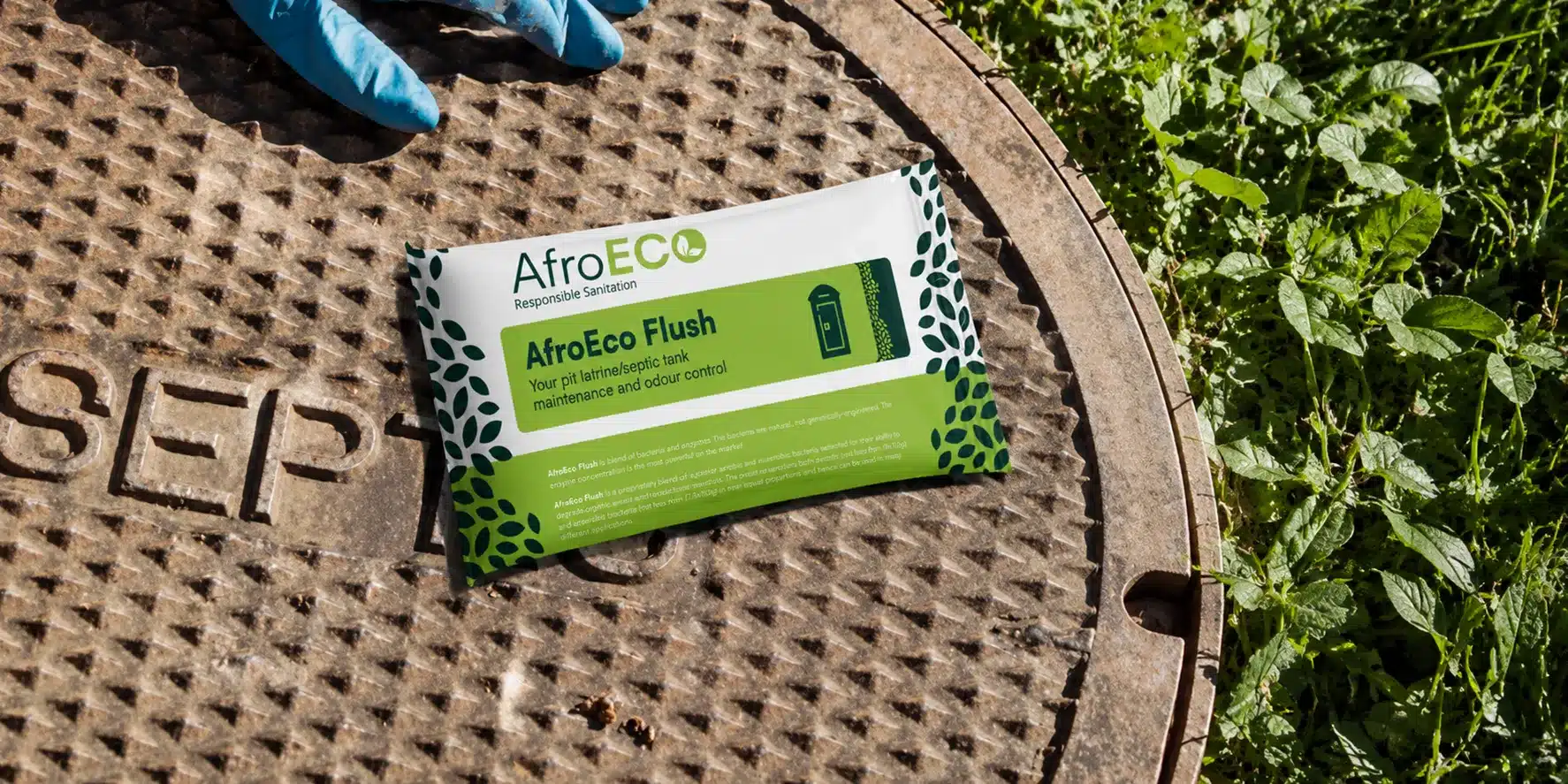 AfroECO Flush septic tank treatment sachet on a septic cover.
